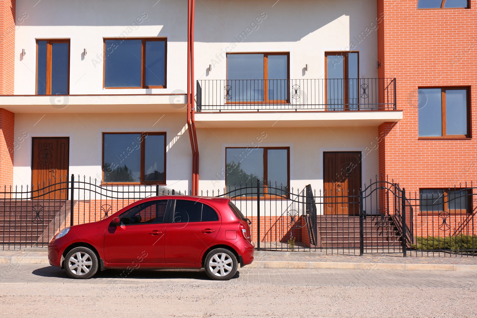 Photo of Color family car near modern buildings in city. Space for text