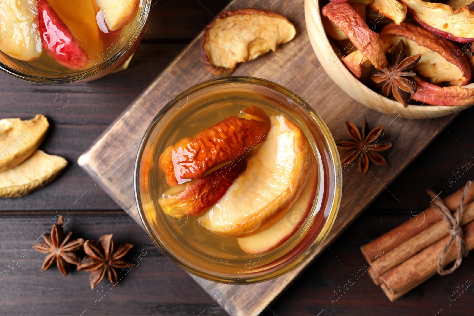 Photo of Delicious compote and ingredients on wooden table, flat lay