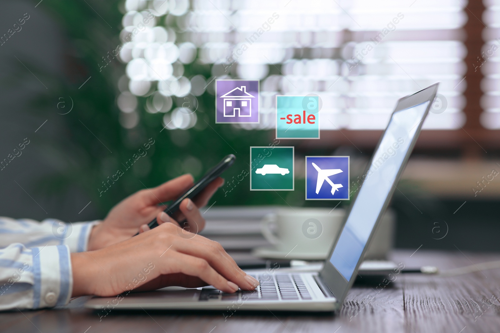 Image of Woman using laptop at table indoors, closeup. Online shopping