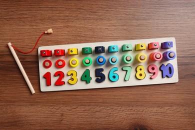 Math game Fishing for Numbers on wooden table, flat lay