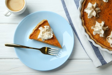Photo of Delicious pumpkin pie with whipped cream, fork and cup of coffee on white wooden table, flat lay