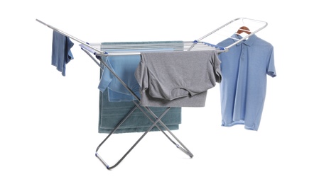 Photo of Modern drying rack with clothes on white background