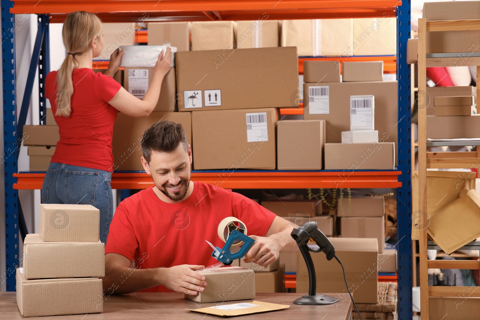 Photo of Man and woman working at post office