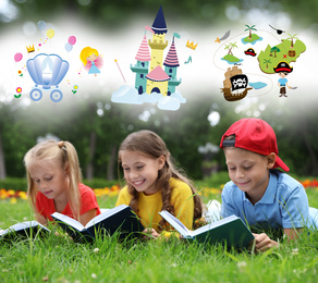 Happy children reading books on green grass outdoors 