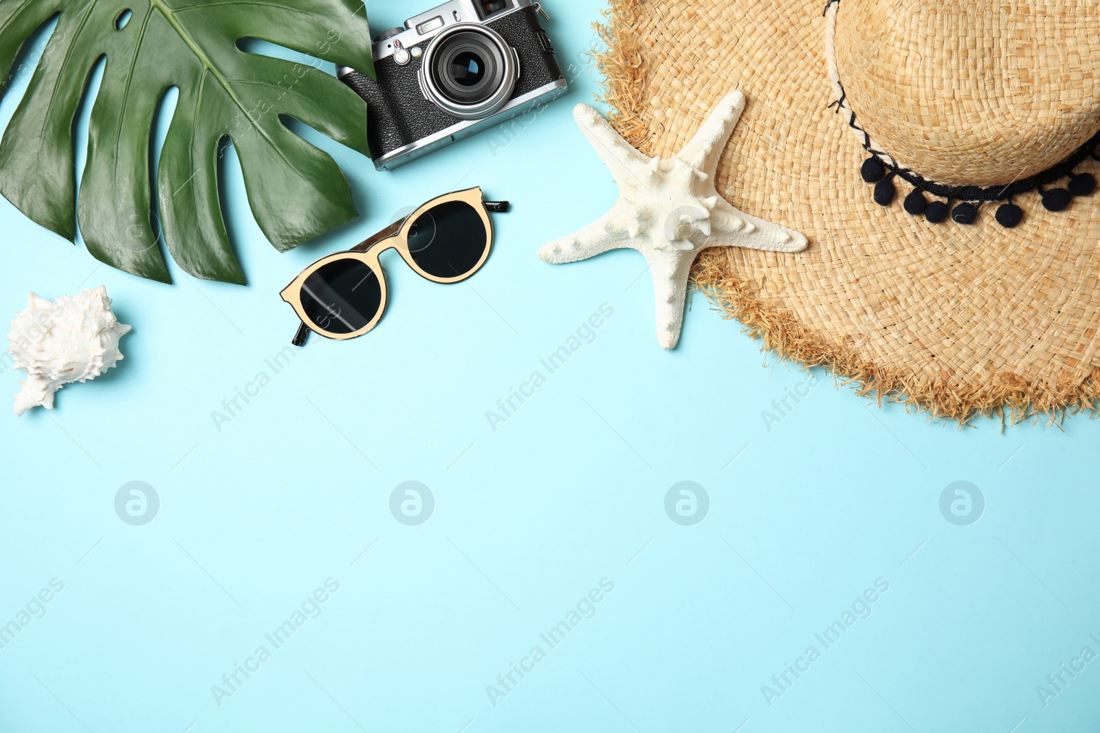 Photo of Flat lay composition with summer accessories, camera and space for text on color background. Travel blogger