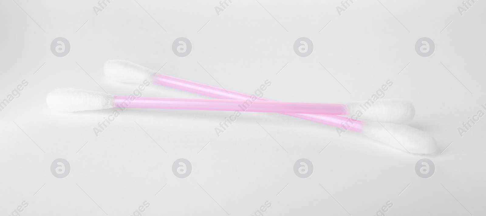 Photo of Clean cotton buds isolated on white. Hygienic product