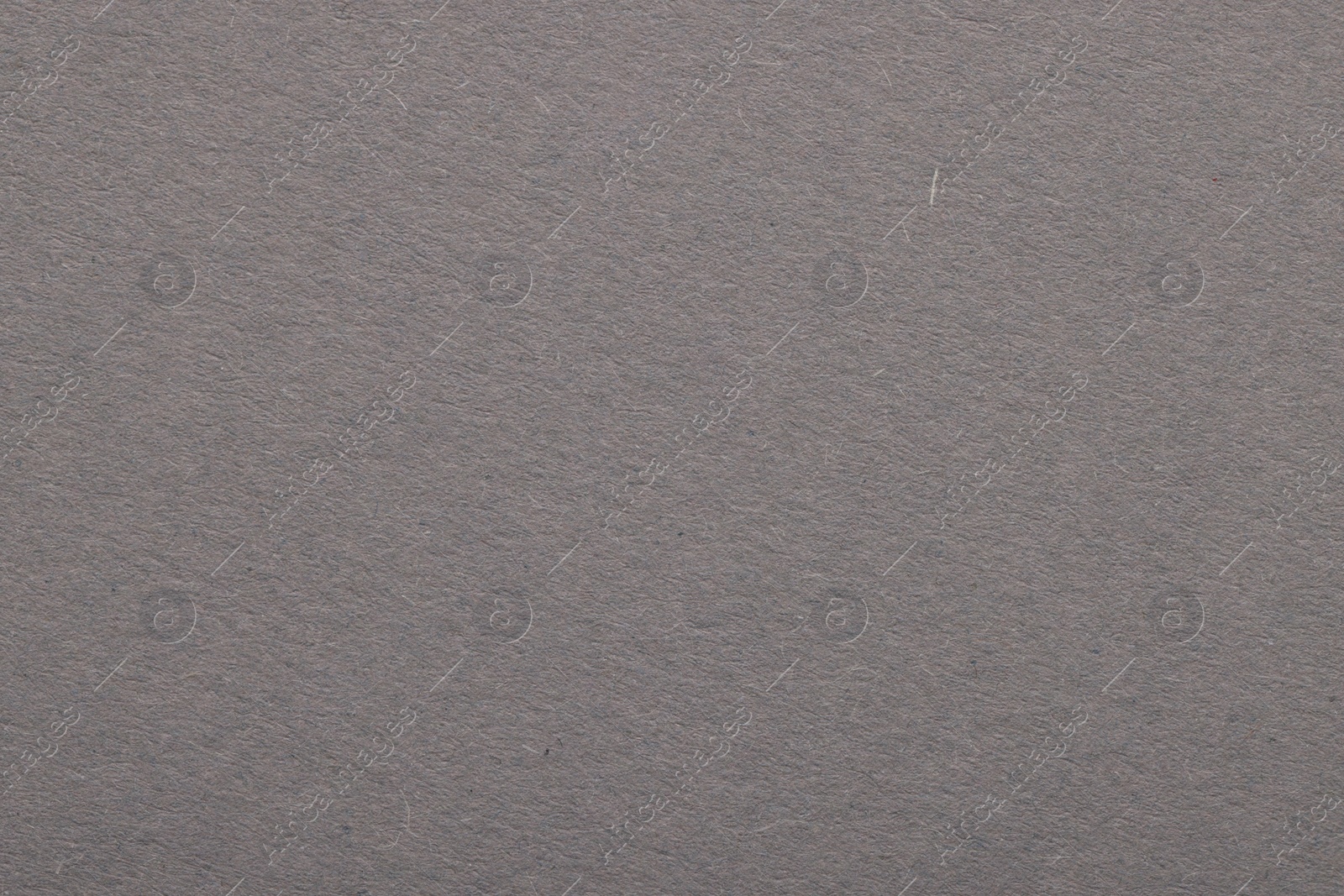 Photo of Texture of grey paper sheet as background, top view