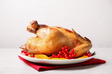 Delicious cooked turkey served on light table. Thanksgiving Day celebration