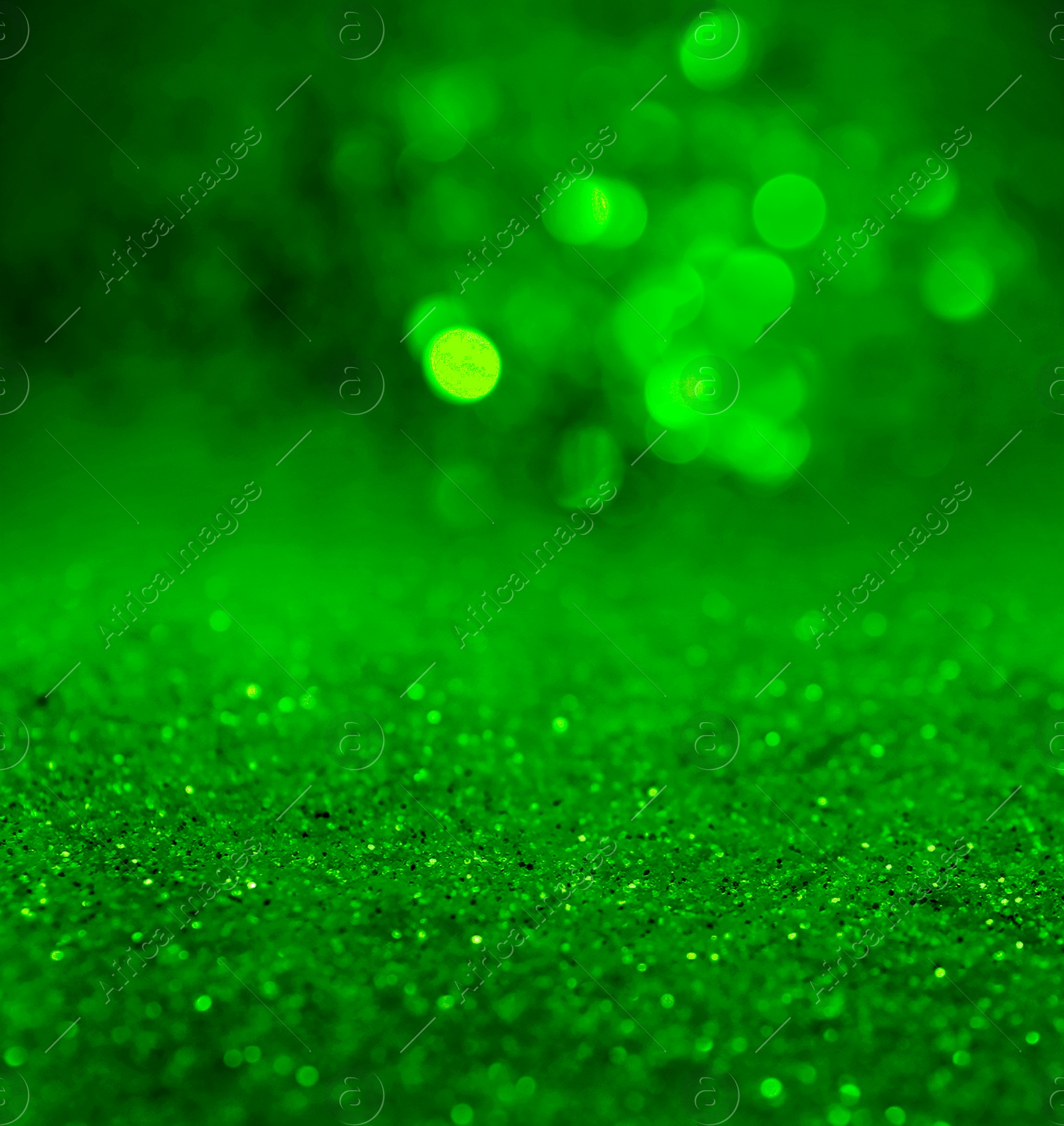 Image of St. Patrick day. Shiny green glitter, closeup. Bokeh effect