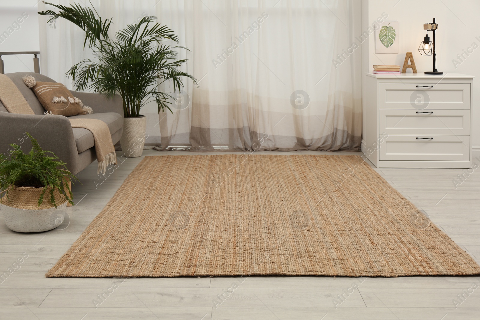 Photo of Stylish rug on floor in room. Interior design