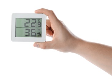 Woman holding digital hygrometer on white background, closeup