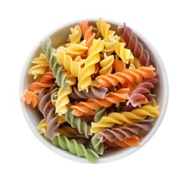 Photo of Bowl with uncooked fusilli pasta on white background, top view