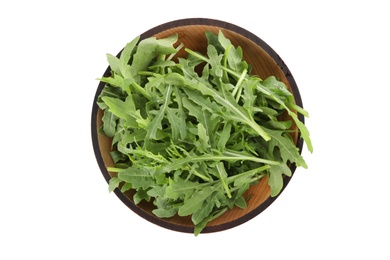 Delicious fresh arugula in wooden bowl isolated on white, top view