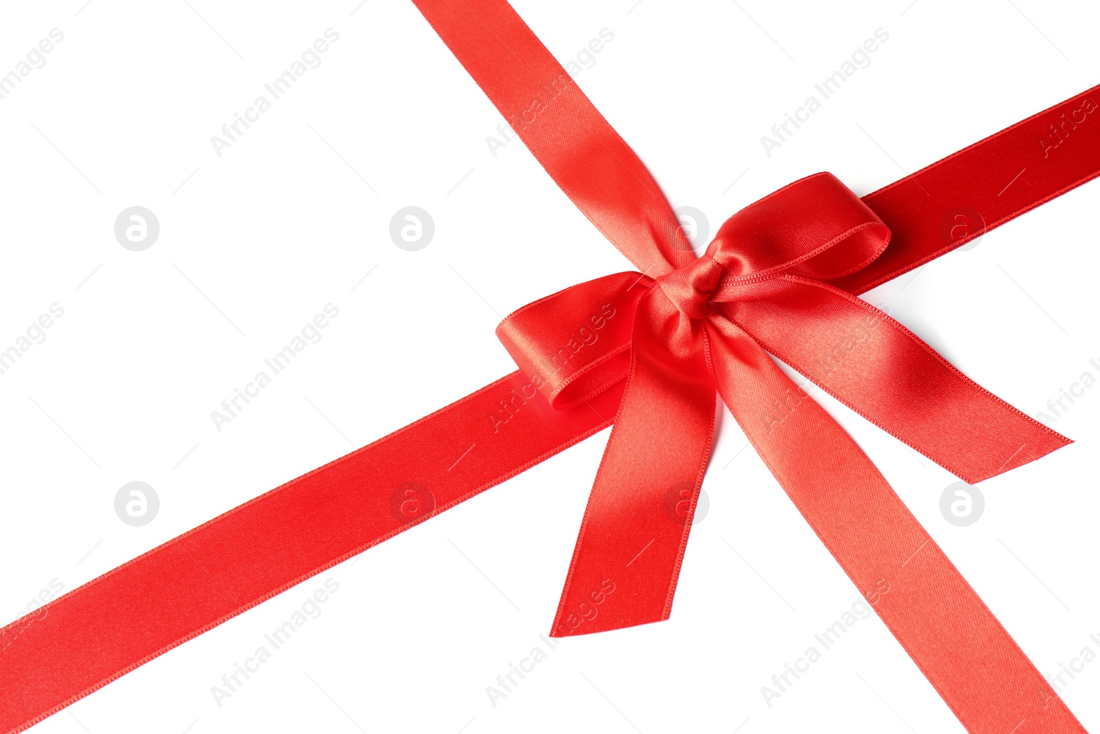 Photo of Red ribbon with bow on white background. Festive decoration