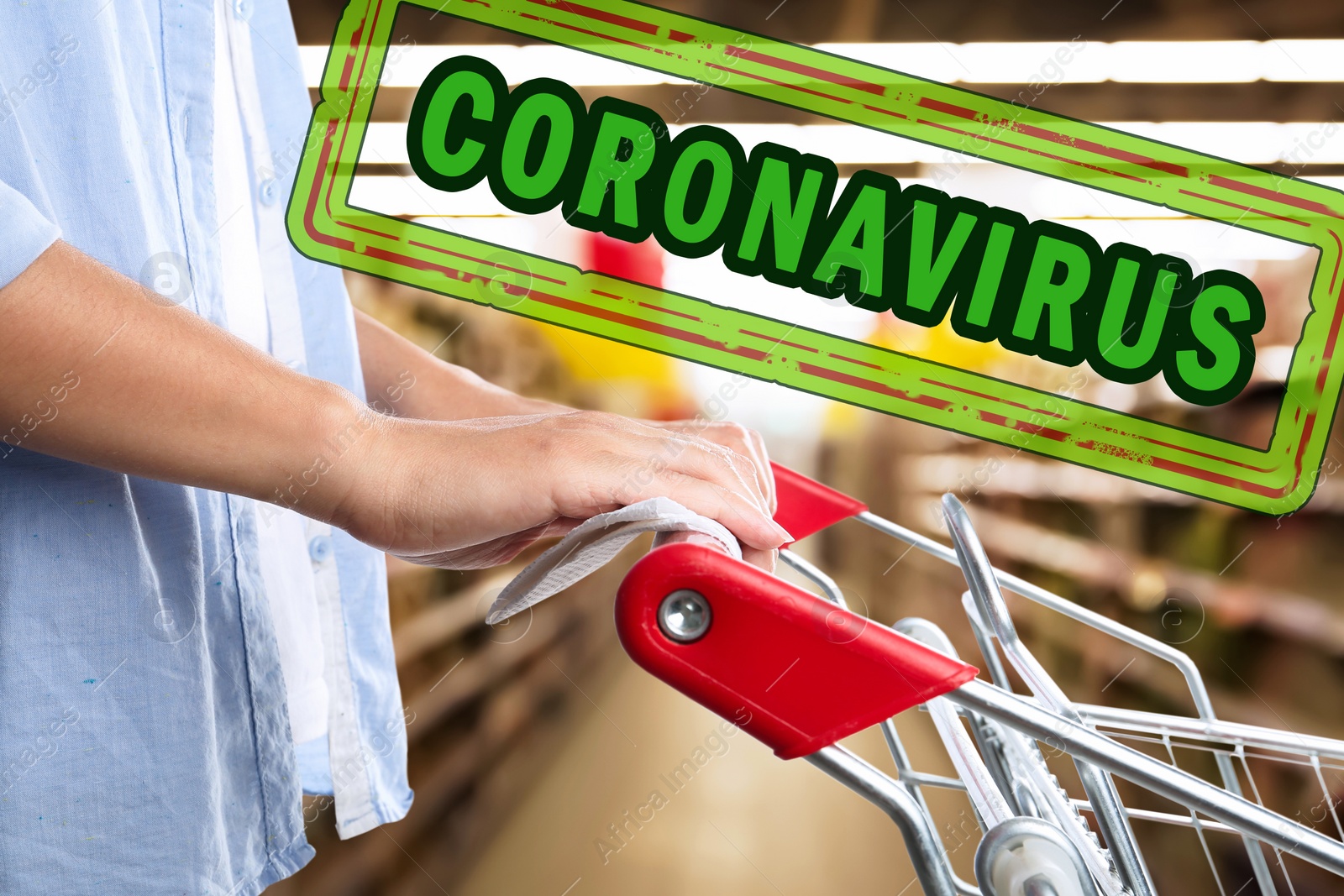 Image of Woman holding shopping cart handle with tissue paper at supermarket, closeup. Preventive measure in public places during coronavirus outbreak