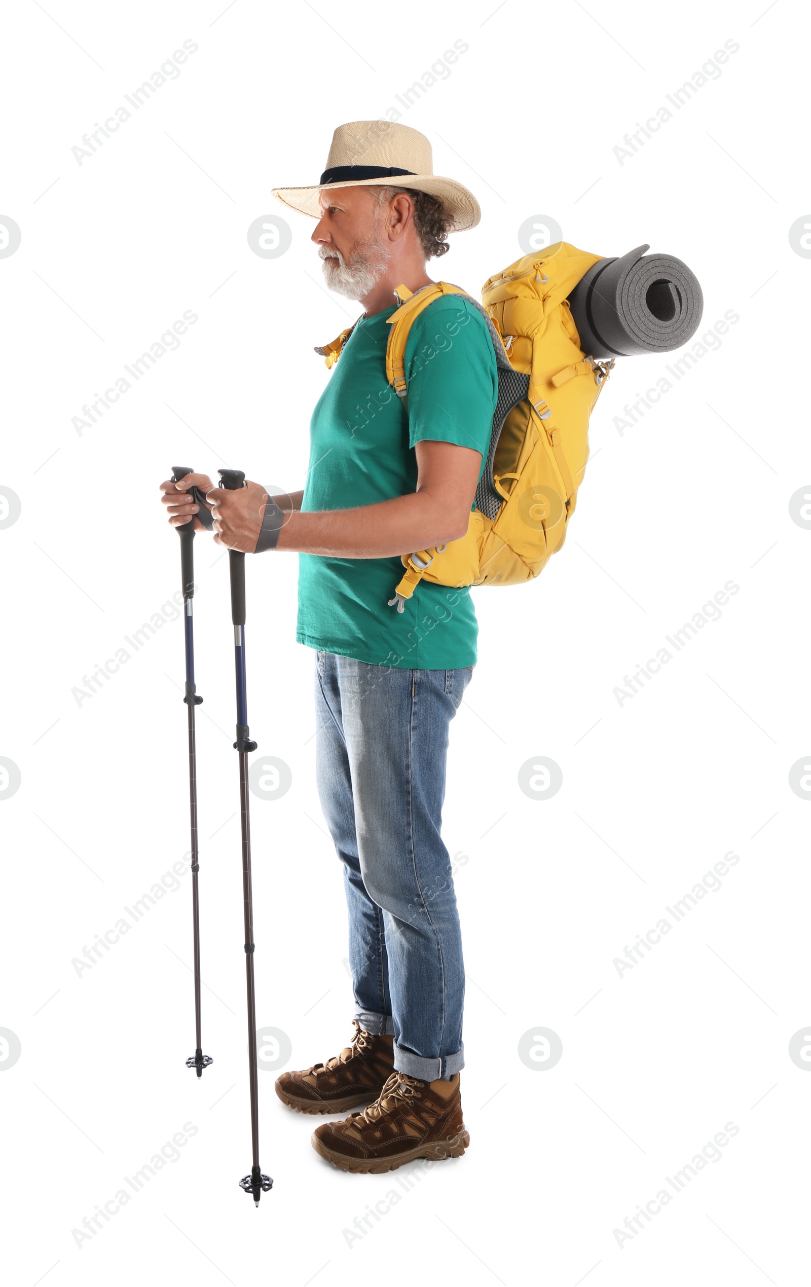 Photo of Male hiker with backpack and trekking poles on white background