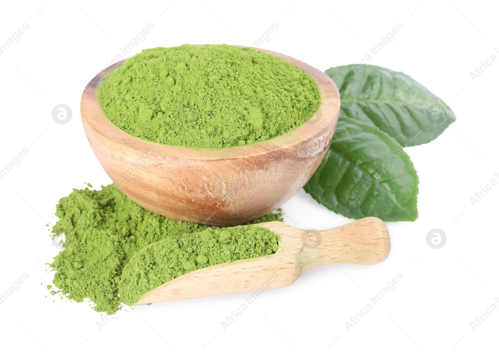 Photo of Leaves, bowl and scoop with matcha powder isolated on white