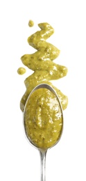 Photo of Delicious pesto sauce and spoon on white background, top view