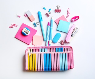 Photo of Flat lay composition with school stationery on white background. Back to school