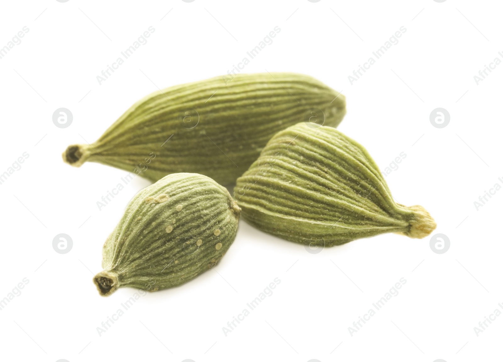 Photo of Dry green cardamom pods on white background, closeup