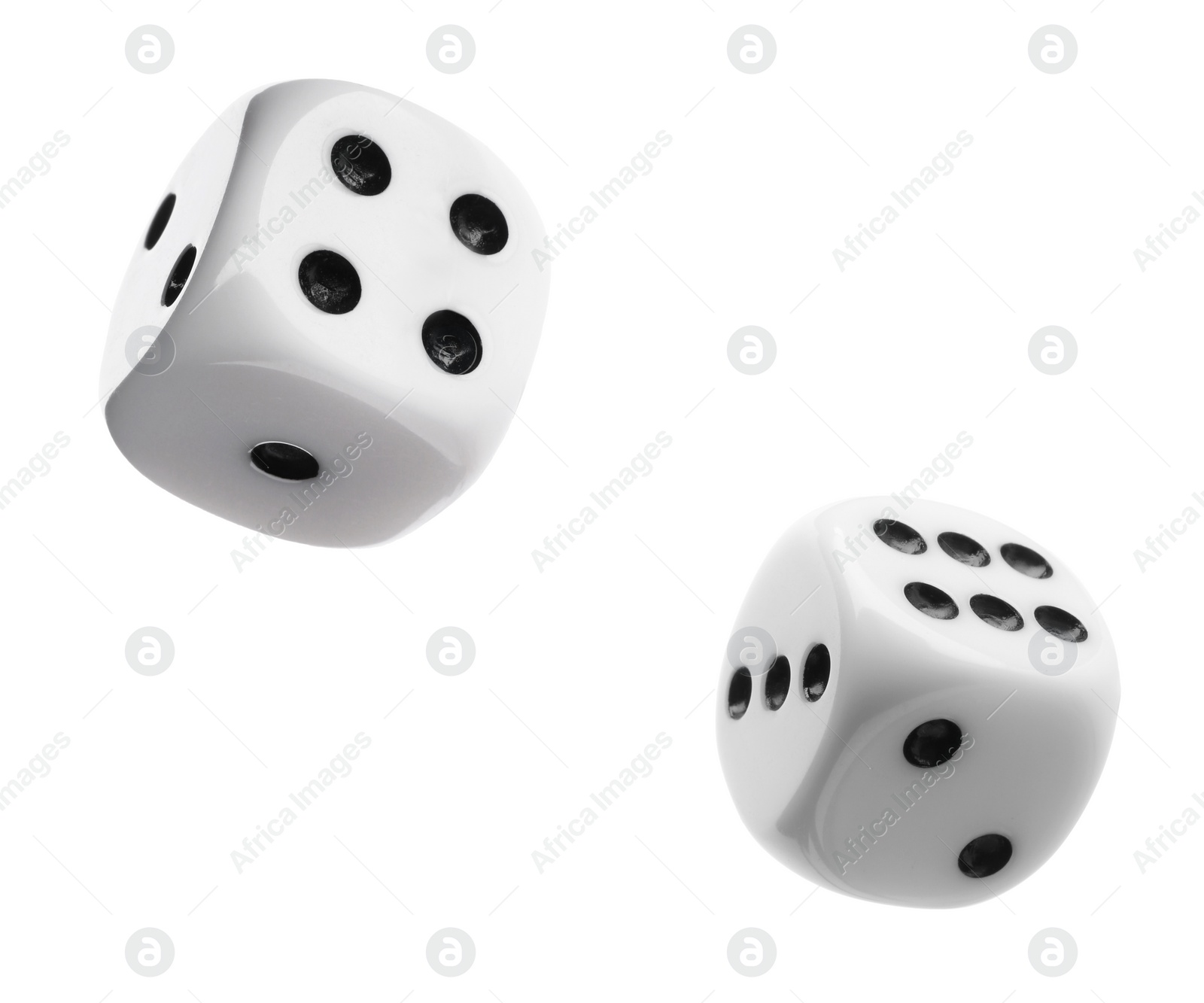 Image of Two dice in air on white background