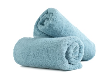 Photo of Rolled soft terry towels on white background