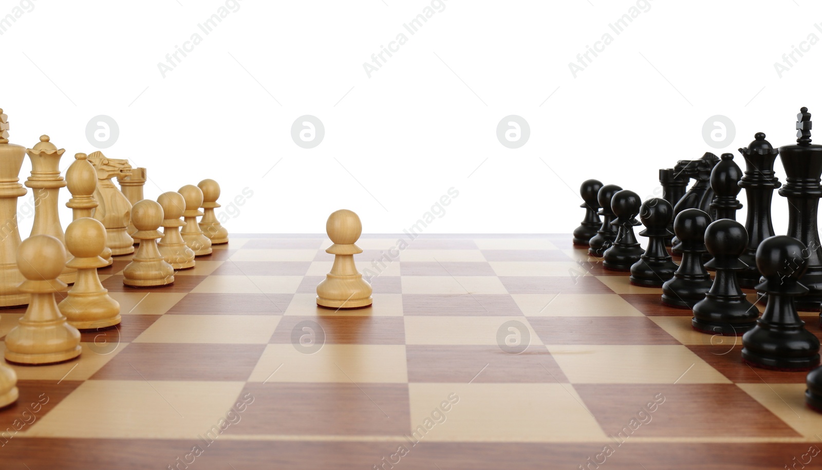 Photo of Chess pieces on wooden board against white background