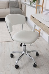 Workplace with comfortable office chair indoors. Interior design