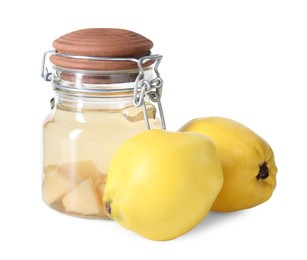 Photo of Delicious quince drink in glass jar and fresh fruits isolated on white