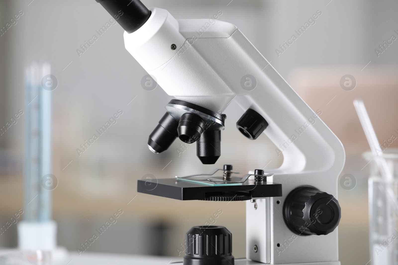 Photo of Modern medical microscope on blurred background, closeup. Laboratory equipment