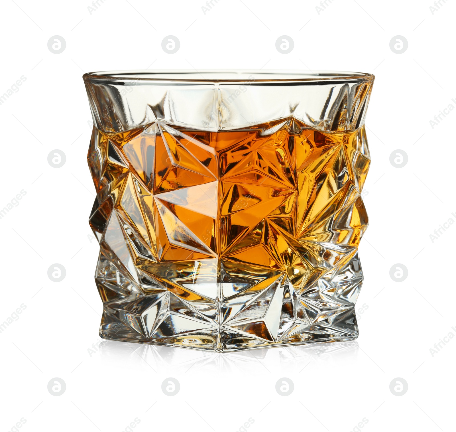 Photo of Whiskey in glass isolated on white. Alcoholic drink