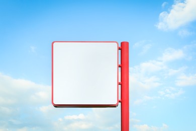 Image of Empty signboard against blue sky. Mock-up for design