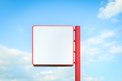 Empty signboard against blue sky. Mock-up for design