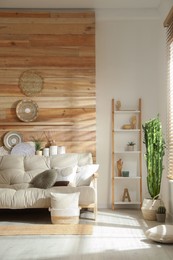 Photo of Living room interior with stylish decor and comfortable sofa