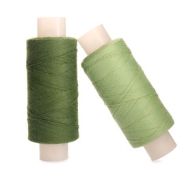 Photo of Different colorful sewing threads on white background