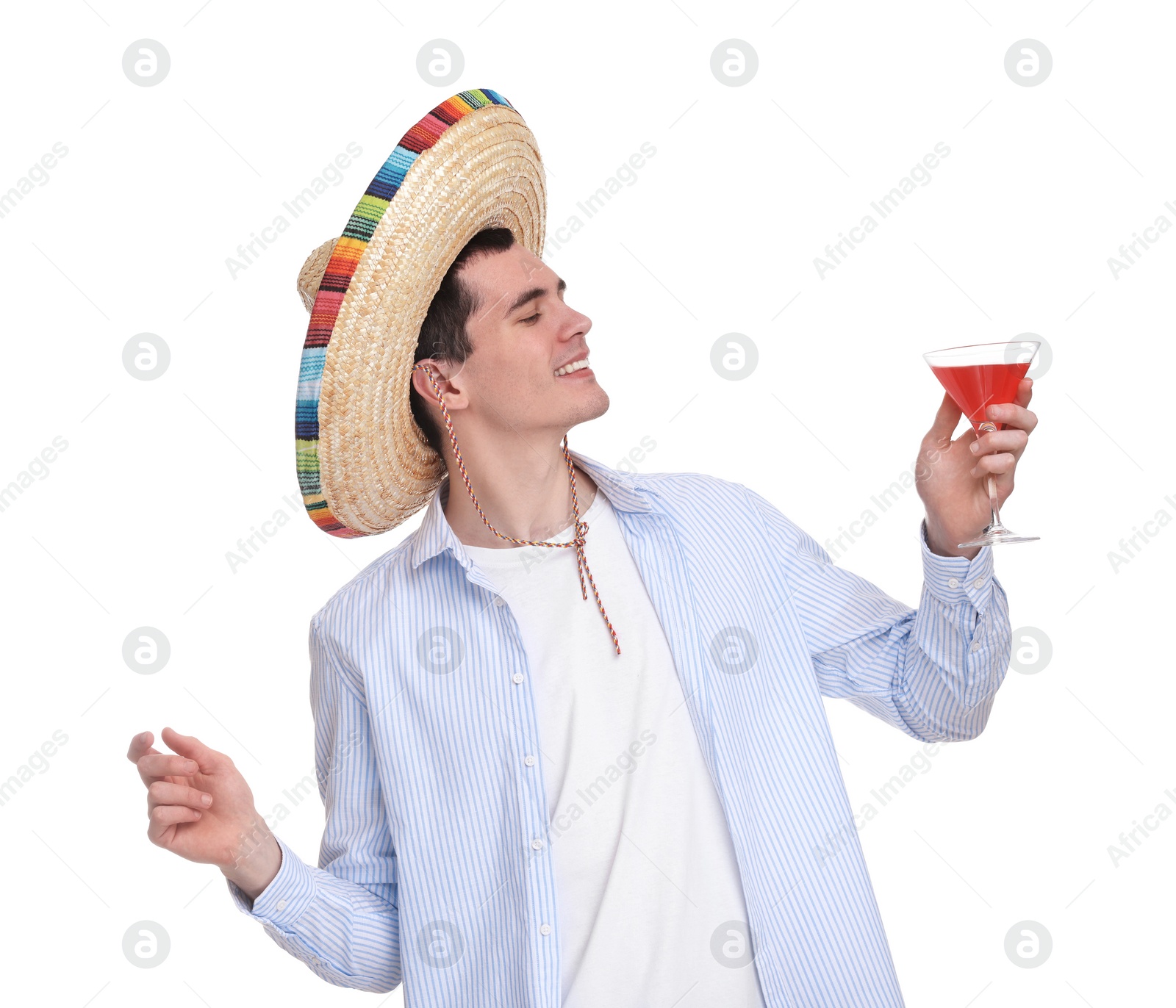 Photo of Young man in Mexican sombrero hat with cocktail on white background