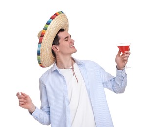 Young man in Mexican sombrero hat with cocktail on white background