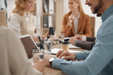 Businesspeople having meeting in office, closeup. Management consulting