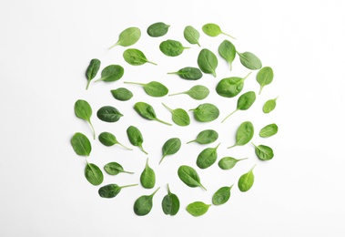 Photo of Fresh green leaves of healthy baby spinach on white background, top view