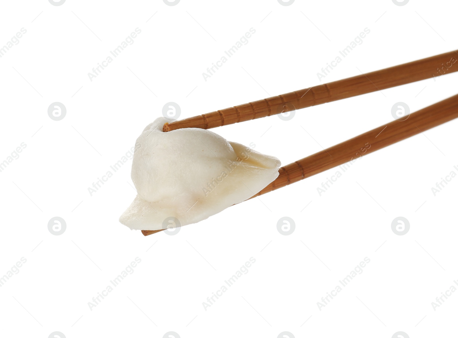 Photo of Chopsticks with tasty dumpling isolated on white