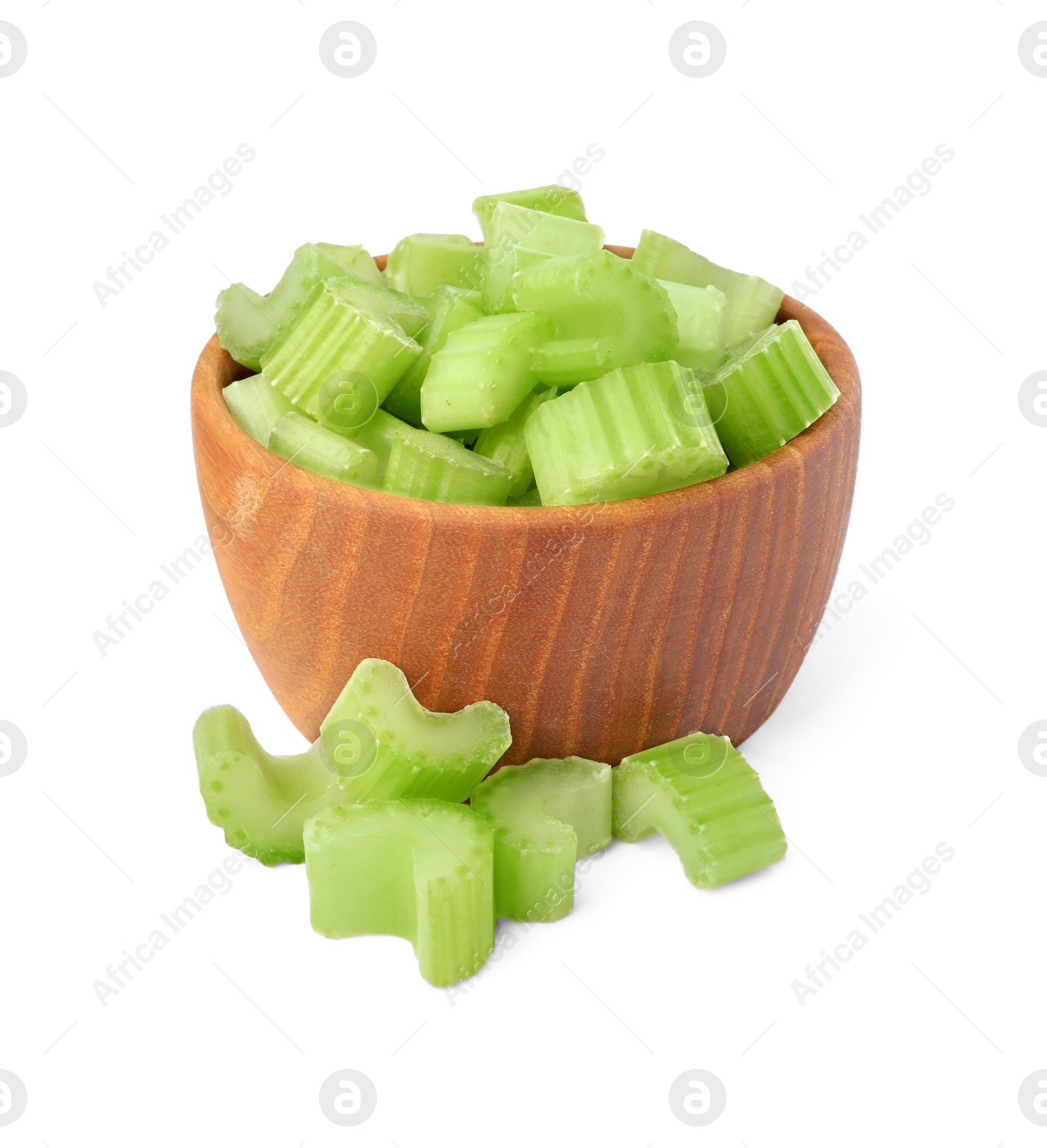 Photo of Wooden bowl of fresh cut celery isolated on white