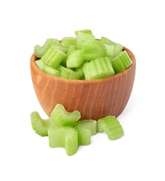 Photo of Wooden bowl of fresh cut celery isolated on white