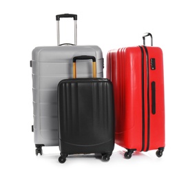 Photo of Modern suitcases for travelling on white background