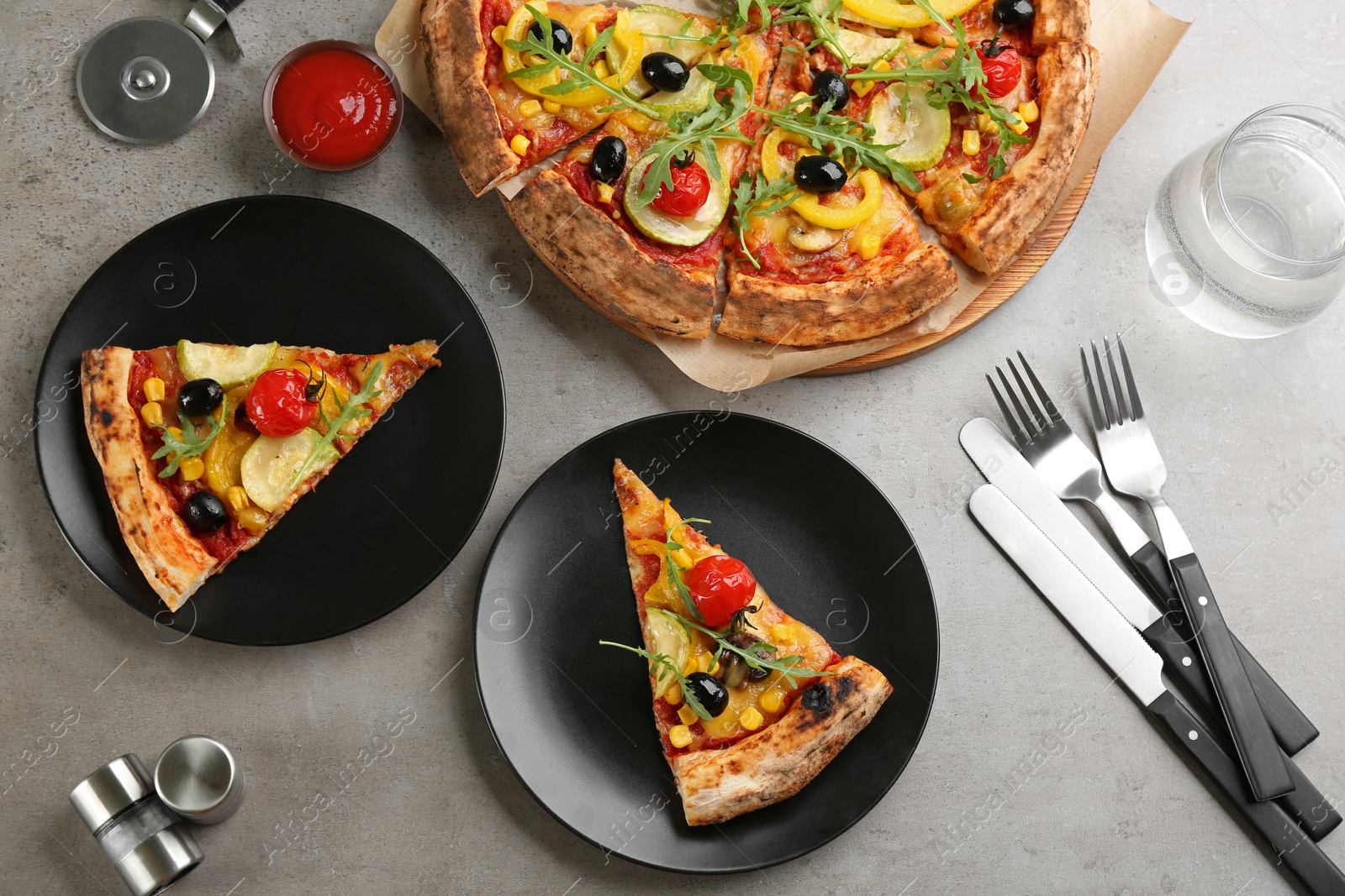Photo of Flat lay composition with vegetable pizza on grey table