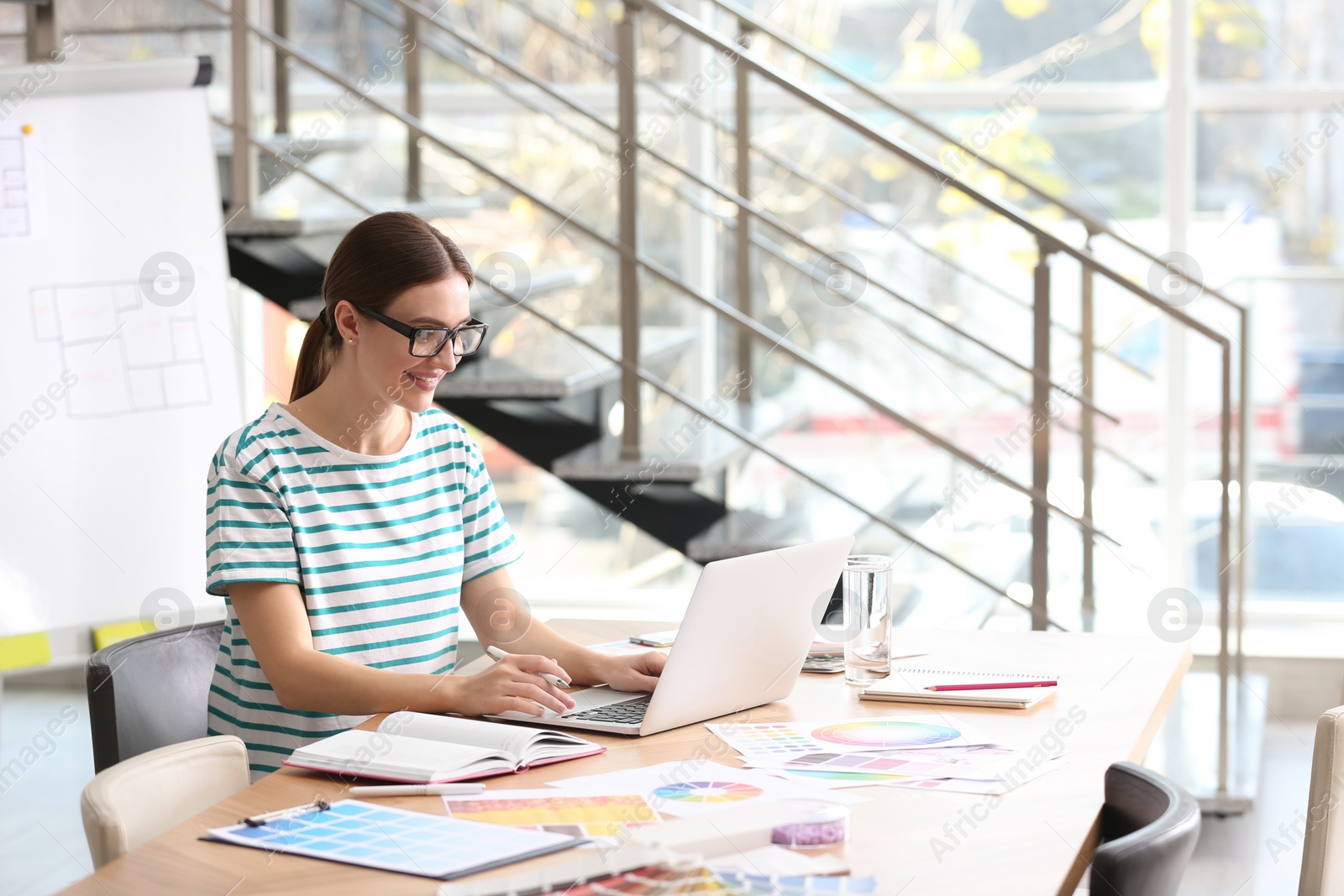 Photo of Professional interior designer at workplace in office