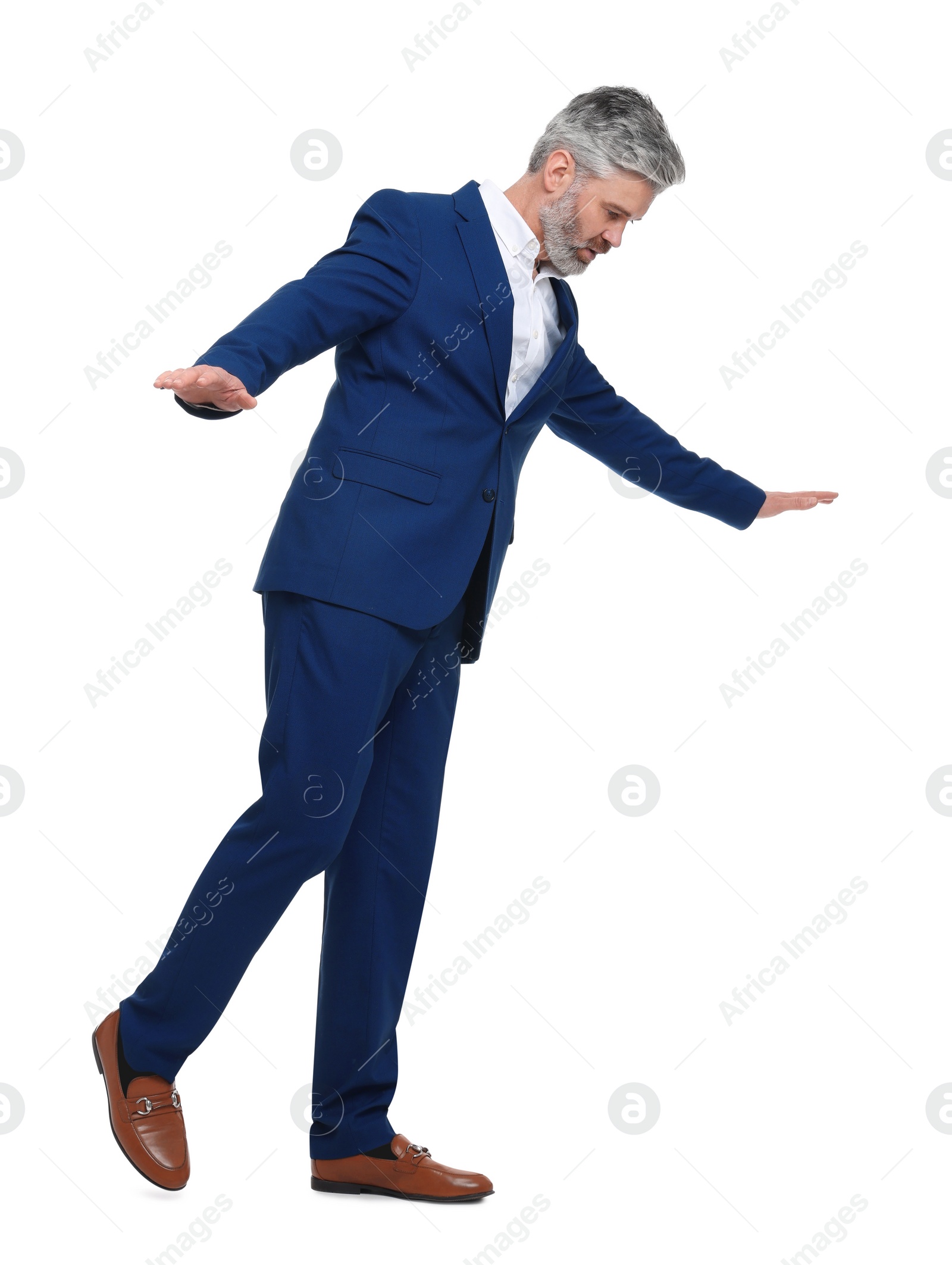 Photo of Mature businessman in stylish clothes posing on white background