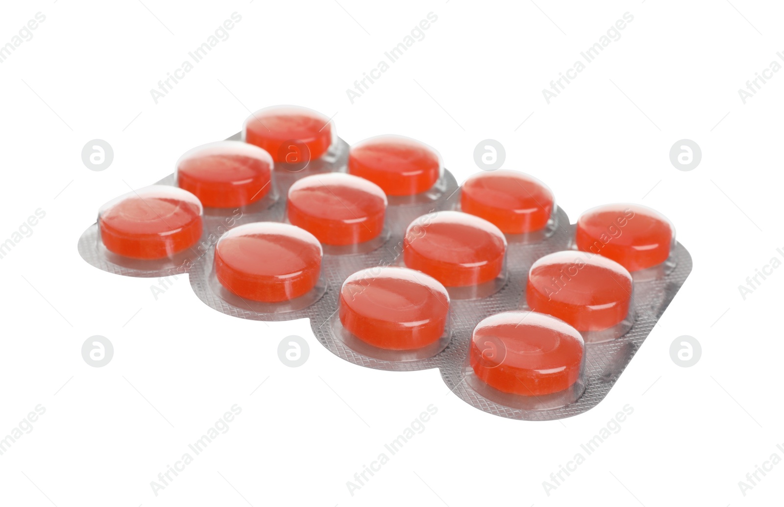 Photo of Blister with orange cough drops isolated on white