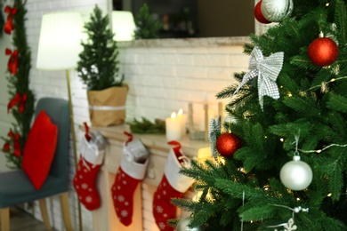 Photo of Blurred view of beautiful festive interior, focus on decorated Christmas tree