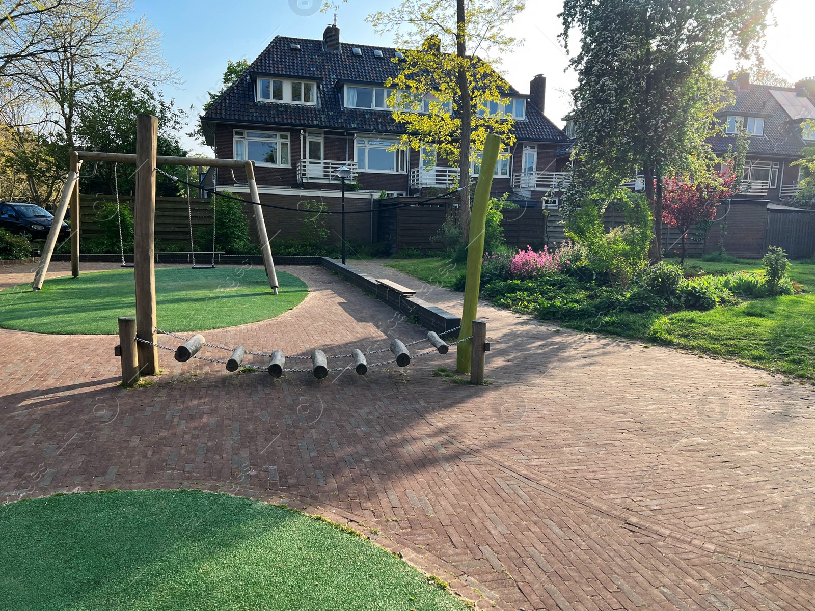 Photo of Outdoor playground for children at backyard of house