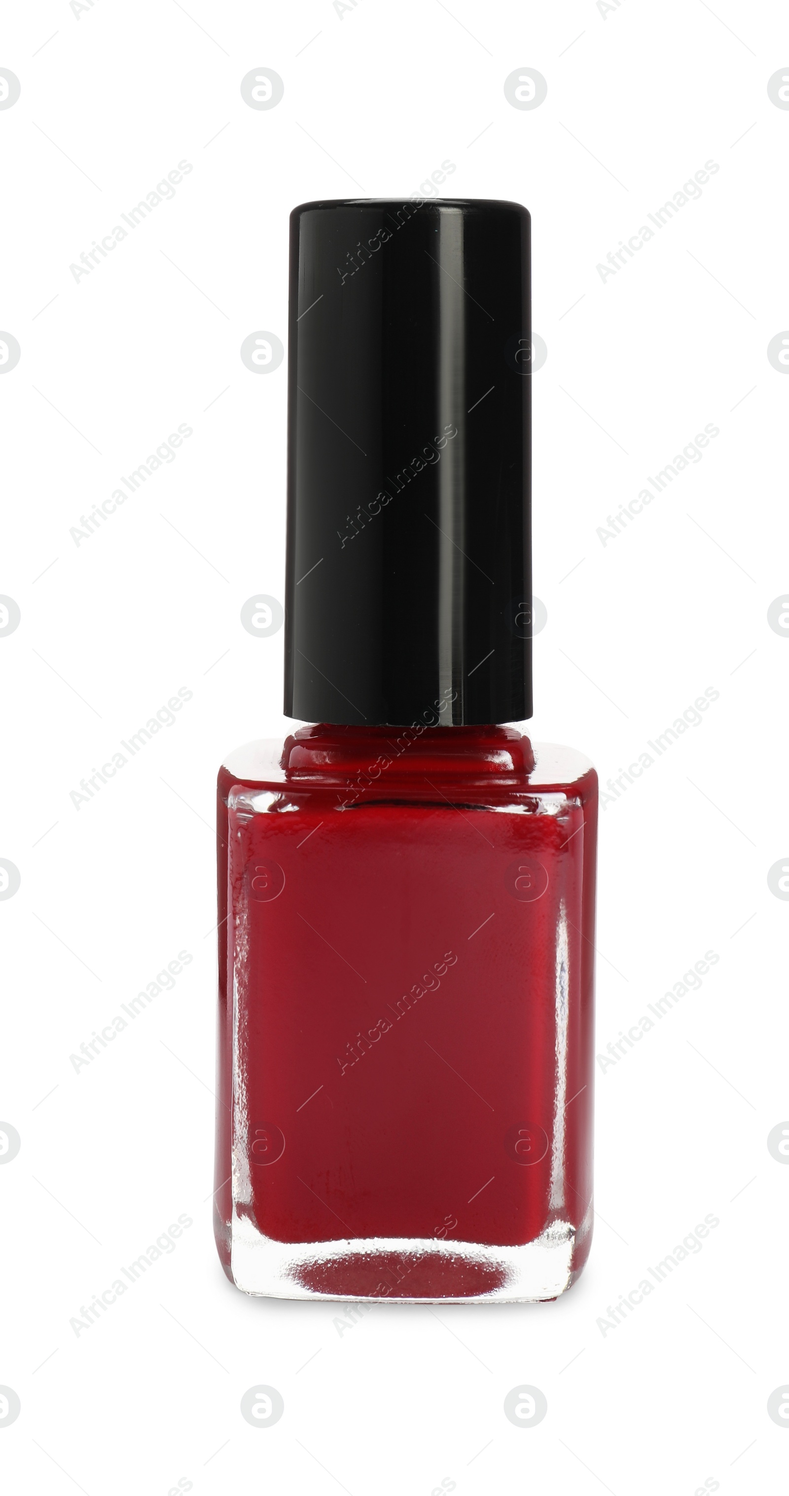 Photo of Red nail polish in bottle isolated on white